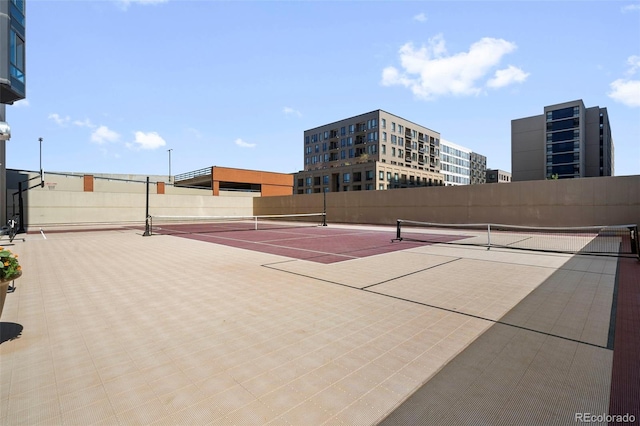 view of tennis court featuring basketball court