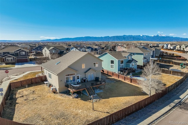 birds eye view of property with a mountain view