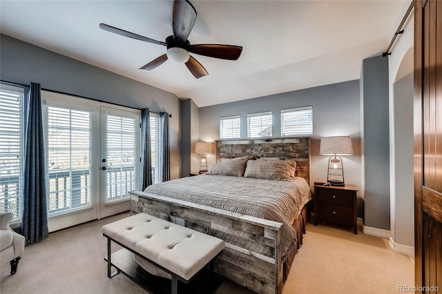 bedroom with vaulted ceiling, a ceiling fan, light colored carpet, baseboards, and access to exterior