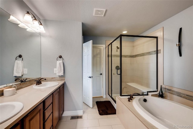 full bathroom with a shower stall, tile patterned floors, a sink, a bath, and visible vents