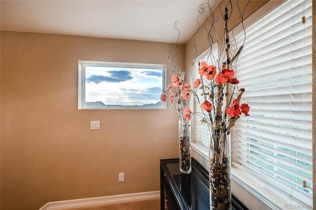 interior space featuring baseboards