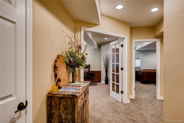 corridor with recessed lighting, carpet flooring, and baseboards