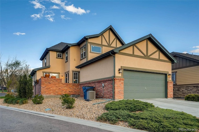 view of home's exterior featuring stucco siding, brick siding, concrete driveway, and a garage