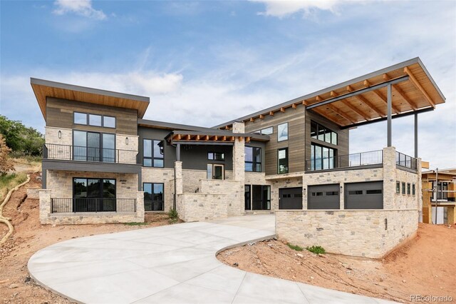 back of property featuring a balcony