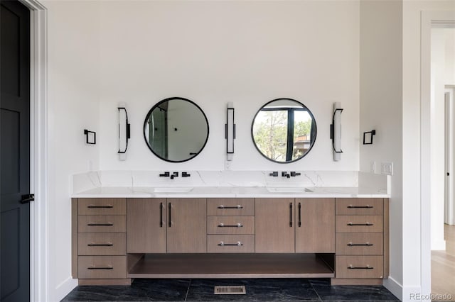 bathroom featuring hardwood / wood-style flooring and vanity