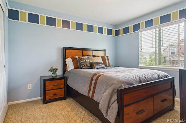 carpeted bedroom with baseboards