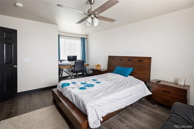 bedroom with wood finished floors, a ceiling fan, a desk, and baseboards