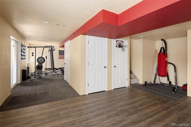 exercise room with wood finished floors