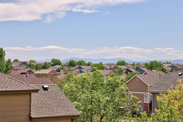 view of mountain background featuring nearby suburban area