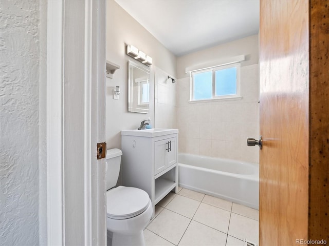 bathroom featuring vanity, toilet,  shower combination, and tile patterned floors
