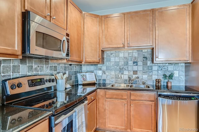 kitchen featuring tasteful backsplash, sink, and appliances with stainless steel finishes