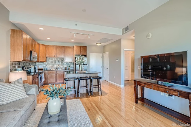 living room with light hardwood / wood-style flooring