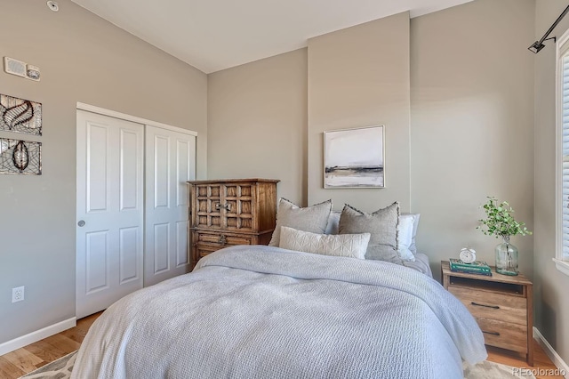 bedroom featuring a closet and light hardwood / wood-style flooring