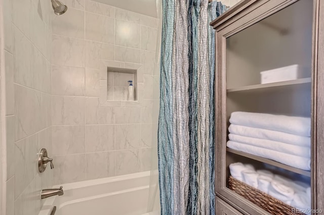 bathroom with shower / tub combo with curtain