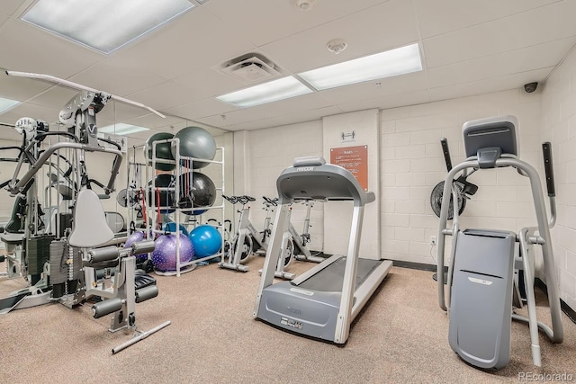 exercise room with a drop ceiling