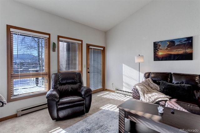 living room with baseboard heating, light carpet, and vaulted ceiling