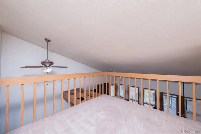 interior space with ceiling fan and lofted ceiling