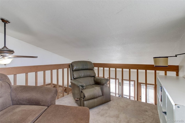 sitting room featuring light colored carpet and ceiling fan