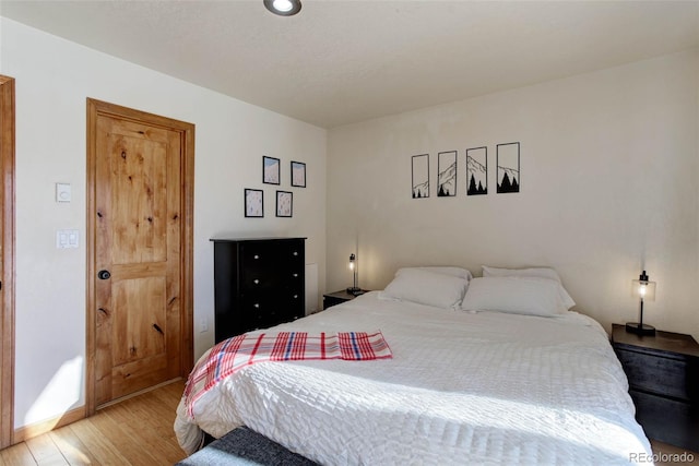 bedroom with light wood-type flooring