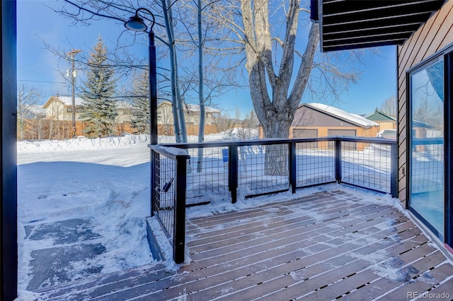 view of snow covered deck