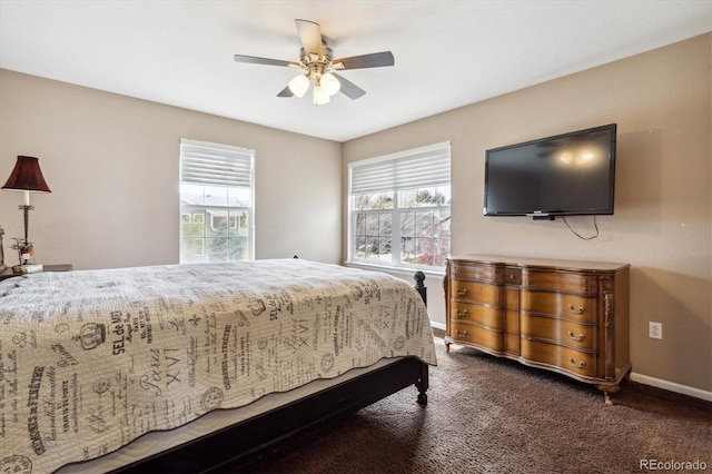 bedroom with dark carpet and ceiling fan