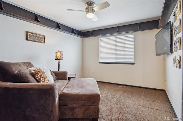 living area featuring carpet floors and ceiling fan