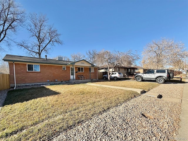 exterior space featuring a carport and a front lawn