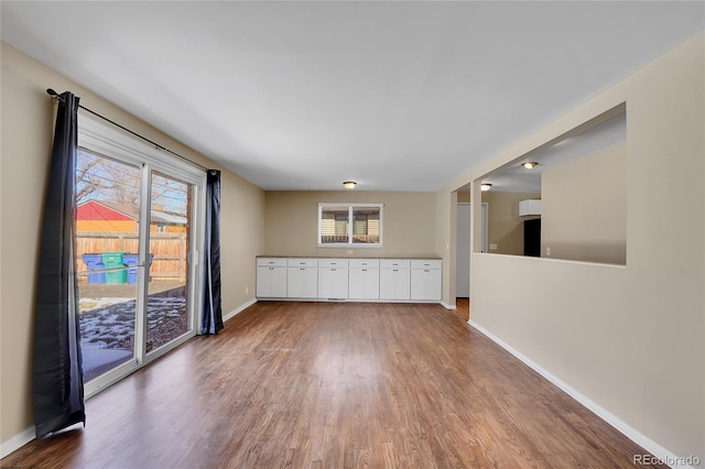 unfurnished room with wood-type flooring