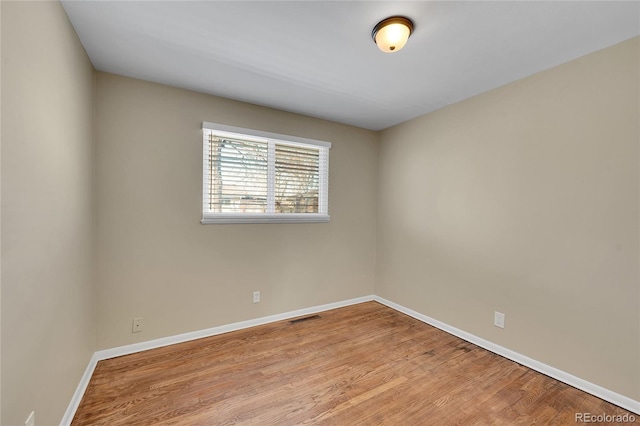 unfurnished room featuring light wood-type flooring