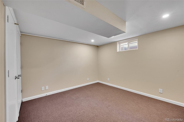 basement with dark colored carpet