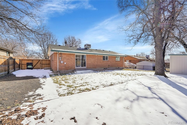 view of snow covered house