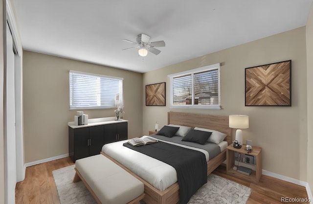 bedroom featuring light wood-type flooring and ceiling fan