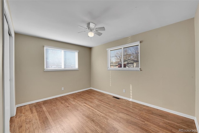 spare room featuring ceiling fan and light hardwood / wood-style floors