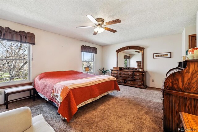 1479 S Jasper St, Aurora, CO 80017 - bedroom with carpet flooring, a textured ceiling, and a ceiling fan