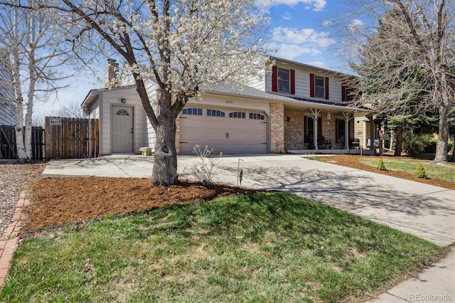 1479 S Jasper St, Aurora, CO 80017 - traditional home with covered porch, driveway, an attached garage, brick siding, and a chimney