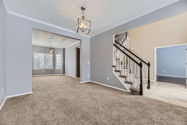 interior space with carpet flooring, crown molding, and an inviting chandelier