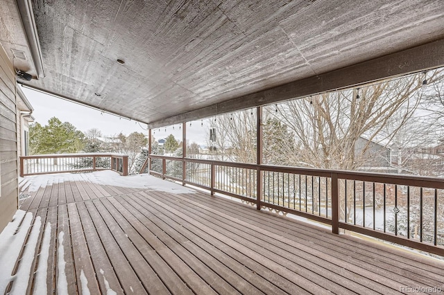 view of snow covered deck