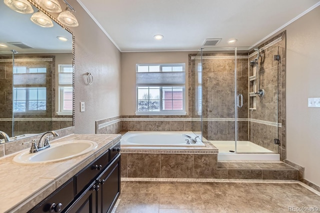 bathroom featuring vanity, crown molding, and independent shower and bath