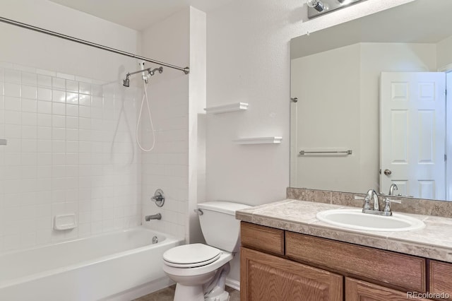 full bathroom featuring vanity, toilet, and tiled shower / bath