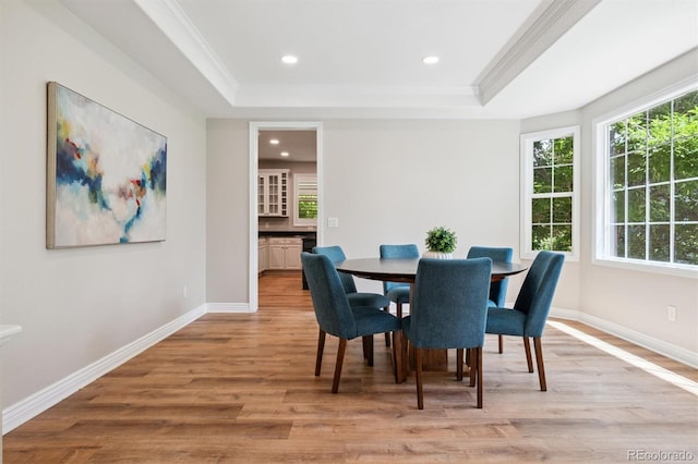 11911 E Lake Cir, Greenwood Village, CO 80111 - dining space with light wood-style flooring, a tray ceiling, ornamental molding, and recessed lighting