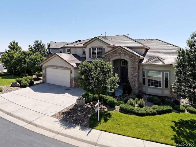 11911 E Lake Cir, Greenwood Village, CO 80111 - traditional-style home featuring stone siding, stucco siding, a tile roof, and concrete driveway