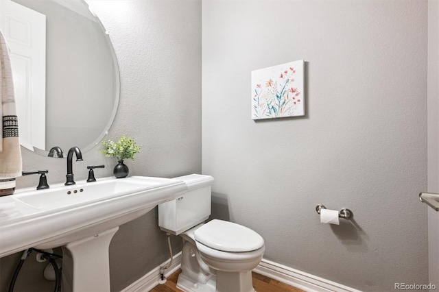 11911 E Lake Cir, Greenwood Village, CO 80111 - bathroom featuring wood finished floors and toilet