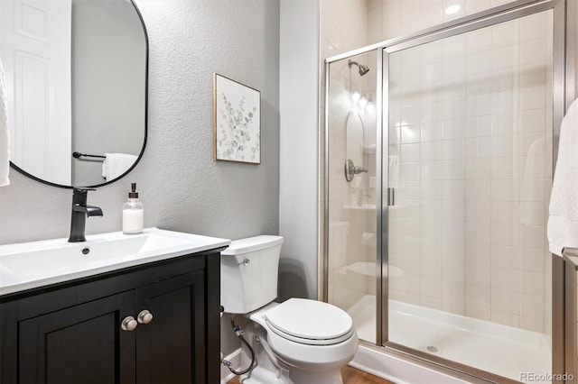 11911 E Lake Cir, Greenwood Village, CO 80111 - full bathroom featuring vanity, a textured wall, and a stall shower