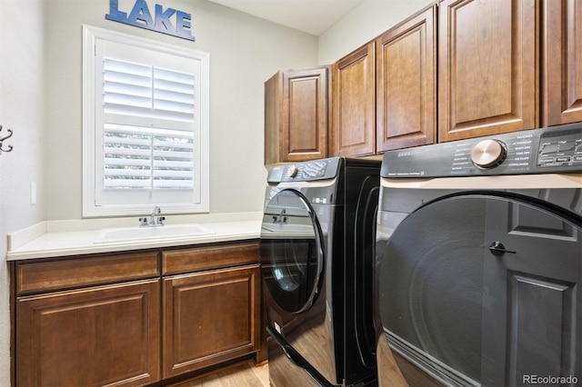 11911 E Lake Cir, Greenwood Village, CO 80111 - laundry room featuring separate washer and dryer and cabinet space