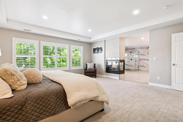 11911 E Lake Cir, Greenwood Village, CO 80111 - bedroom with multiple windows, a tray ceiling, recessed lighting, carpet floors, and a multi sided fireplace