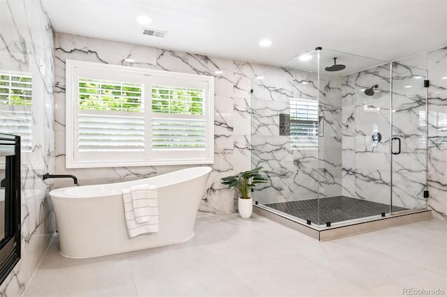 11911 E Lake Cir, Greenwood Village, CO 80111 - bathroom with a marble finish shower, a freestanding bath, marble finish flooring, and recessed lighting