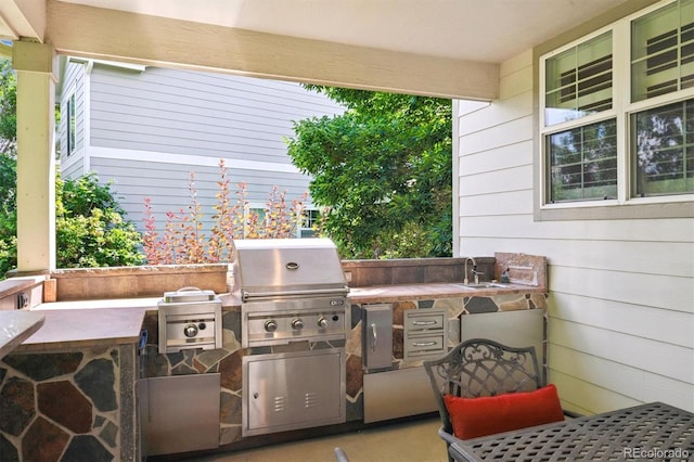 11911 E Lake Cir, Greenwood Village, CO 80111 - view of patio / terrace featuring exterior kitchen and a sink