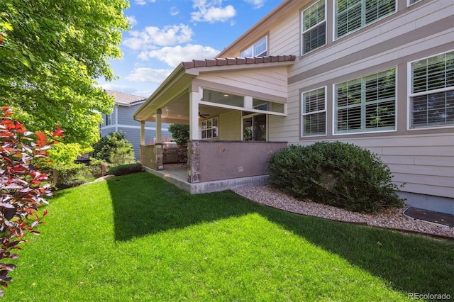 11911 E Lake Cir, Greenwood Village, CO 80111 - view of grassy yard featuring a patio area