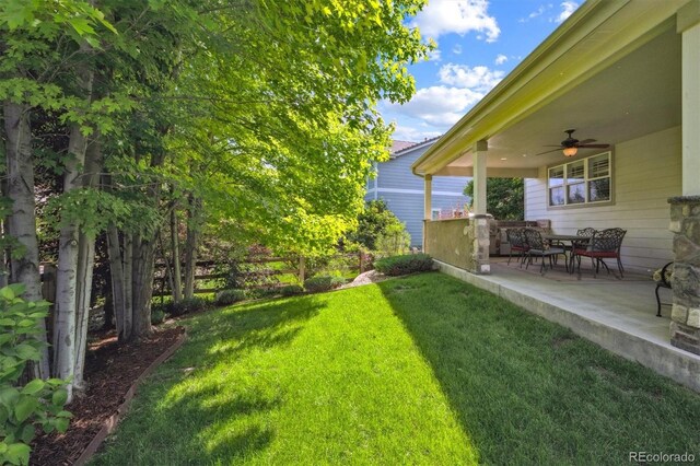 11911 E Lake Cir, Greenwood Village, CO 80111 - view of green lawn featuring a ceiling fan