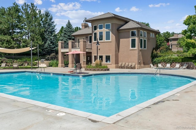 11911 E Lake Cir, Greenwood Village, CO 80111 - community pool featuring a patio